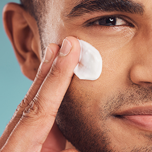 Shop for Men's Skincare Products - man using skincare on his face