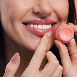 Shop for Lip Care -Woman with lip moisturizer
